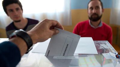 A man casts his ballot at a polling station in Ronda near Malaga during general elections in Spain on April 28, 2019. Spain returned to the polls for unpredictable snap elections marked by the resurgence of the far-right after more than four decades on the outer margins of politics. / AFP / JORGE GUERRERO