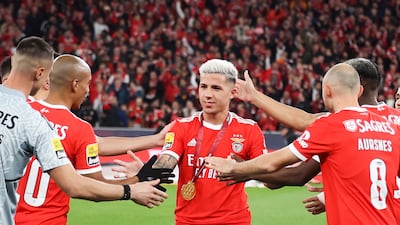 Enzo Fernandez is congratulated by his Benfica teammates after receiving a medal of honor for winning the Qatar World Cup with Argentina, before the Primeira Liga match against Sporting Lisbon, in Lisbon, on January 15, 2023. EPA