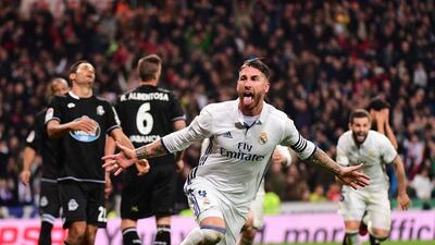 Real Madrid defender Sergio Ramos celebrates after scoring against RC Deportivo at the Santiago Bernabeu stadium in Madrid on December 10, 2016. Pierre-Philippe Marcou / AFP