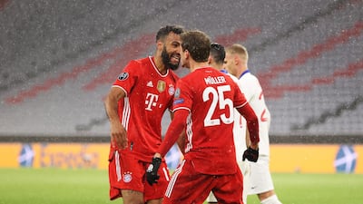 Thomas Muller celebrates with team mate Eric Maxim Choupo-Moting after levelling the scores. Getty