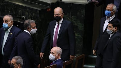 Iraqi President Barham Salih (centre) attends the swearing in ceremony for Iran's new president at the parliament in the Islamic republic's capital Tehran.