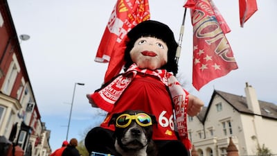 A dog joins the Liverpool the protest. Reuters