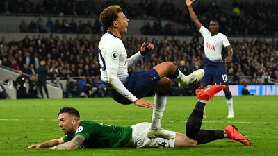 Brighton's Shane Duffy, left, tackles Tottenham's Dele Alli. Reuters