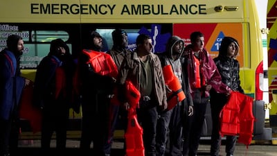 A group of people thought to be migrants are brought in to Dungeness, in Kent, England, after a small-boat incident in the Channel on Wednesday night. AP