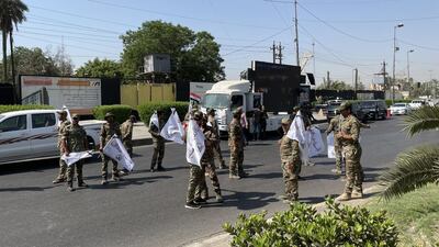 PMF fighters and supporters are preparing for the funeral procession near Baghdad’s fortified Green Zone for four fighters killed in Monday’s US air strikes along Iraq-Syria border. Sinan S. Mahmoud / The National
