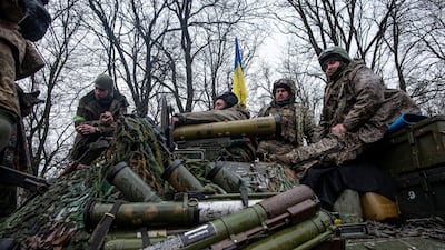 Ukrainian servicemen sit atop a tank in eastern Ukraine on Tuesday as the battle for the Donbas got under way. Photo: Press service of the Ukrainian Ground Forces/Handout via Reuters