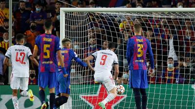 Bayern Munich's Robert Lewandowski scores their second goal. Reuters