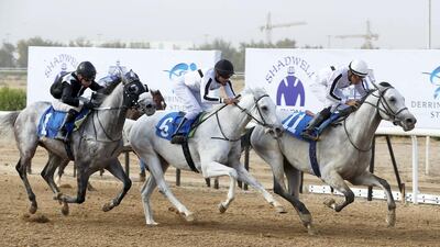 Mubasher Al Khalediah, right, ridden by Abdullah Al Fairoz wins the inaugural Gulf Cup at the Sharjah Equestrian and Racing Club in Sharjah. Pawan Singh / The National
