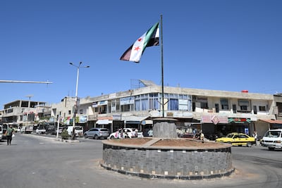 Syria's flag flutters in Quneitra city, near the buffer zone in the Israeli-annexed Golan Heights. AFP