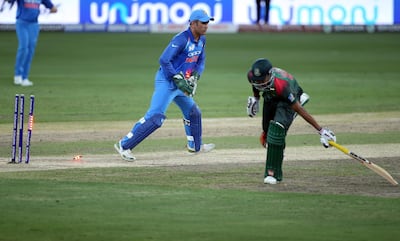 MS Dhoni, left, has too much experience to be dropped just months before the 2019 World Cup gets under way. AP Photo