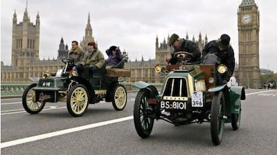 A troubled 1904 Lacoste et Battmann veteran car, right, is passed by a 1904 Cadillac on Westminster Bridge in London during the London to Brighton veteran car run on Nov. 6. AP Photo