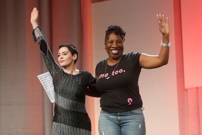 Founder of the #MeToo campaign Tarana Burke (R) introduces Actor Rose McGowan to speak during the opening session of the three-day Women's Convention at Cobo Center in Detroit