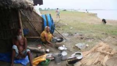 Mr Niyamat Shaikh, left, has lost six houses to the river Ganga in the past 10 years.