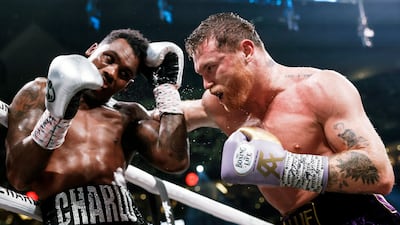 Saul 'Canelo' Alvarez, right, in action in his win against Jermell Charlo last September. EPA