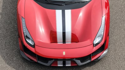 The exterior is replete with tip-to-tail racing stripe. Ferrari