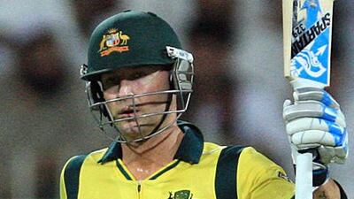 Michael Clarke hails the crowd at Sharjah after making 50 runs during the ODI against Afghanistan.