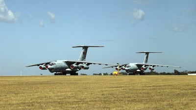 Two Chinese Ilyushin IL-76s aircraft sit on the tarmac at RAAF Pearce base ready to join the search for the missing Malaysia Airlines flight MH370 in Perth, Australia. More planes were joining the search of a remote patch of the southern Indian Ocean. Rob Griffith / AP Photo March 23