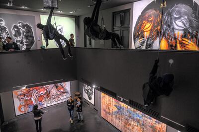 Works by Snik and Doto Dot Dot at the Urban Nation Museum. AFP
