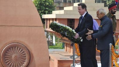 David Cameron, the British prime minister, places a wreath at the Jallianwala Bagh memorial in Amritsar on Wedneday. Munish Sharma / Reuters