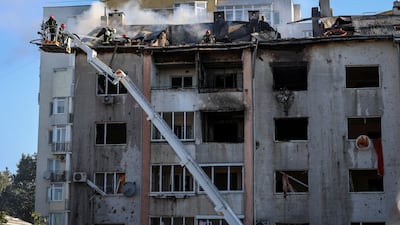 First responders work at the site of a block of flats destroyed by a Russian missile strike in Lviv. Reuters