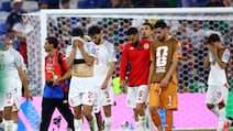 Tunisia players look dejected after the match. Reuters