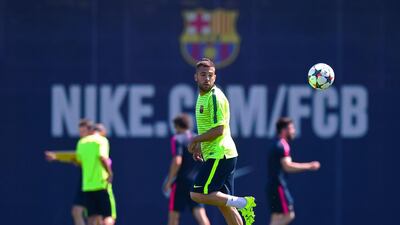 Barcelona's Jordi Alba flicks the ball on Tuesday during the club's training session for the Champions League final on Saturday against Juventus. David Ramos / Getty Images