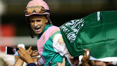 Mike Smith riding Arrogate celebrates winning the Dubai World Cup. Francois Nel / Getty Images