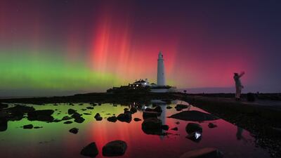 The northern lights over St Mary's Lighthouse in Whitley Bay, north-east England. PA