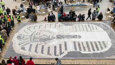 Media reports state that Guinness World Records organised the event to celebrate Egypt for 'breaking the world record with a picture of King Tutankhamun's mask' by using a total of 7,260 cups of coffee. EPA