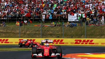 Sebastian Vettel and Kimi Raikkonen had their Ferraris 1-2 in the early going of the Hungarian Grand Prix. Vettel went on to win but Raikkonen did not finish the race due to a mechanical failure. Clive Mason / Getty Images
