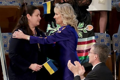 The Ukrainian ambassador to the US, Oksana Markarova, is hugged by first lady Dr Jill Biden as she is recognised by President Joe Biden at his State of the Union address. AP