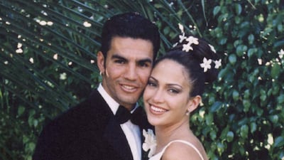 Lopez wore a simple, lace column dress for her wedding to her first husband Ojani Noa in 1997. AFP