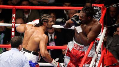 British boxer David Haye, left, prepares to land a punch during his three round win over compatriot Audley Harrison in their WBA heavyweight title fight, in Manchester, England, Saturday Nov. 13, 2010. (AP Photo/Jon Super) *** Local Caption *** MJS139_Britain_Boxing_Haye_Harrison.jpg