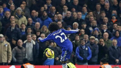 Chelsea's Willian shoots and scores the 89th minute winner in a 1-0 Premier League victory over Everton on Wednesday night at Stamford Bridge. Justin Tallis / AFP