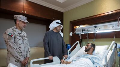 President Sheikh Mohamed visits Capt Mohamed Al Nuaimi, who was injured while serving with the UAE Armed Forces in Somalia, at Zayed Military Hospital. All photos: Abdulla Al Neyadi / UAE Presidential Court