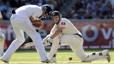England's Alastair Cook, left, and Steve Smith from Australia in action.