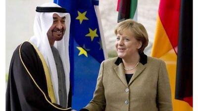 The German chancellor, Angela Merkel, greets Sheikh Mohammed bin Zayed, Crown Prince of Abu Dhabi, on his arrival in Berlin yesterday.