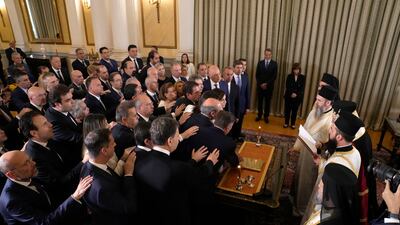 The members of Greece's new government take the oath during a swearing in ceremony at the Presidential palace, in Athens, Greece, on Tuesday, June 27, 2023. Greece's center-right leader Kyriakos Mitsotakis cabinet has been sworn in as his New Democracy party had 40. 55%, more than twice the opposition Syriza party's 17. 84% on Sunday's elections. (AP Photo / Thanassis Stavrakis)