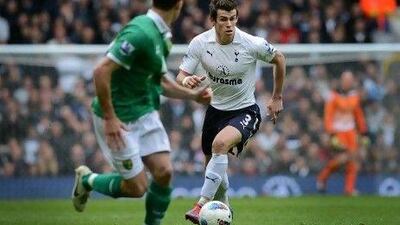 Welsh midfielder Gareth Bale, right, is rumoured to be on Barcelona's radar, but Tottenham Hotspur manager Harry Redknapp says Bale is happy with the Spurs.