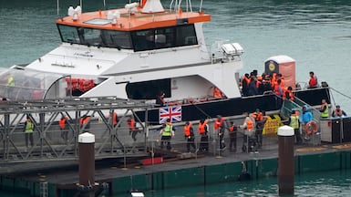 People who set out from France are taken ashore at the port of Dover in Kent, southern England. PA Wire