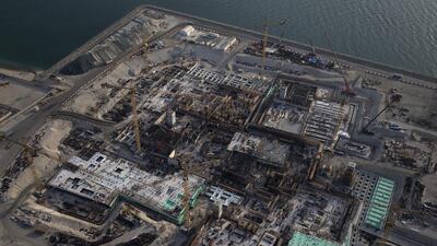 The Arabian Gulf is kept at bay a temporary dam around the site. Once it is completed, the dam will be removed and the Louvre Abu Dhabi will appear to float above the water. Silvia Razgova / The National