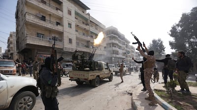 Turkish-backed Free Syrian Army members are seen celebrating in Afrin, Syria on March 18, 2018. Khalil Ashawi / Reuters