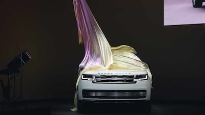 The covers coming off the car at its London launch