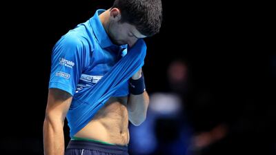 Novak Djokovic of Serbia looks dejected in his final game. Last year's world No 1 was knocked out in the group stage after being beaten by Roger Federer. Getty