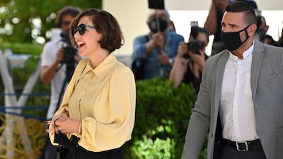 Actress Maggie Gyllenhaal, left, arrives at the reception at the Martinez Hotel on July 5. AFP