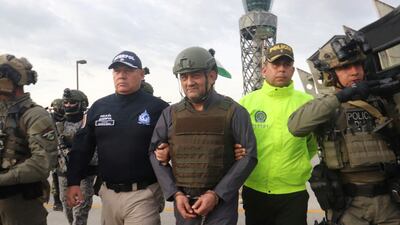 Colombian drug trafficker Dairo Antonio Usuga David, also known as 'Otoniel', is escorted by police after Colombia extradites him to the US. Reuters
