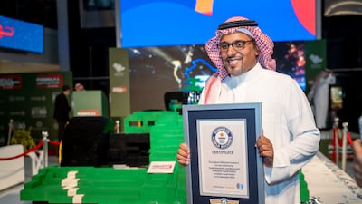 Prince Khalid Bin Sultan Al Faisal, chairman of the Saudi Automobile and Motorcycle Federation, with the Guinness World Record. Courtesy Saudi Arabian Grand Prix