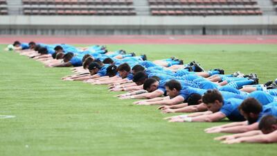 New Zealand players warming-up at Kashiwanoha Stadium. AFP
