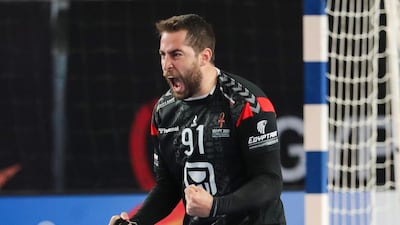 Egypt's right winger Mohammad Sanad celebrates a goal during the 2021 World Men's Handball Championship quarterfinal match against Denmark at the Cairo Stadium Sports. AFP