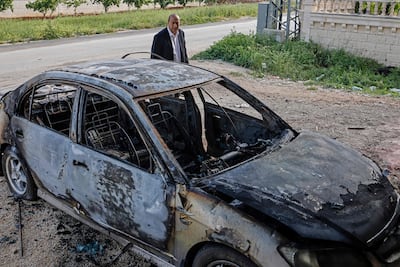 A car burnt by an Israeli settler attack in the occupied West Bank. AFP